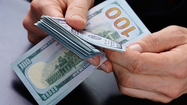 Tỷ giá trung tâm vượt 25.000 VND/USD sau quyết định của Fed